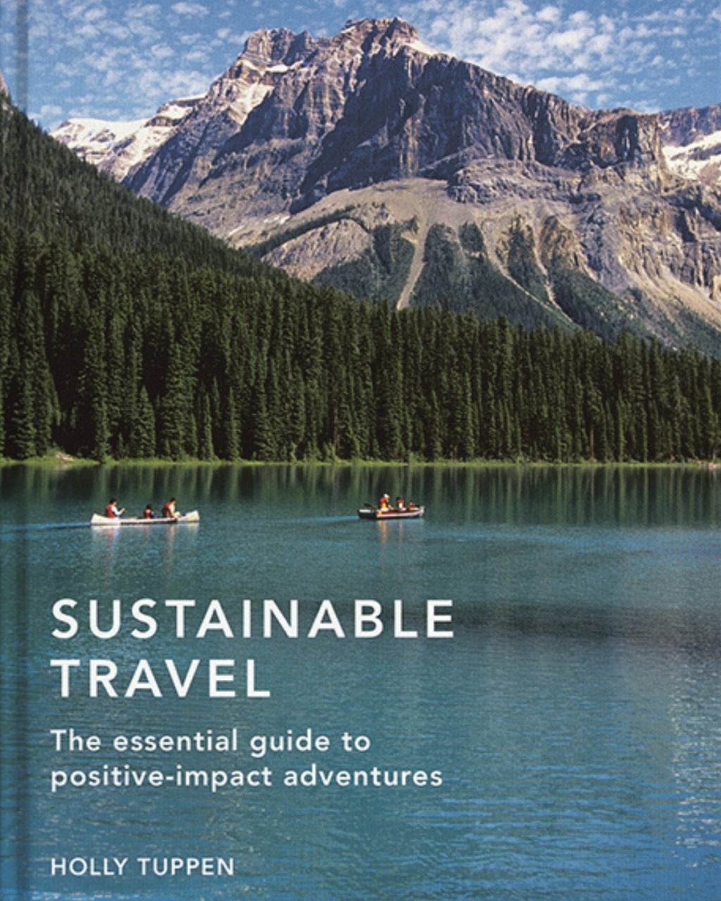Cover of "Sustainable Travel" shows canoers on a serene lake surrounded by dense forest and majestic mountains under a blue sky. Calm adventure vibe.