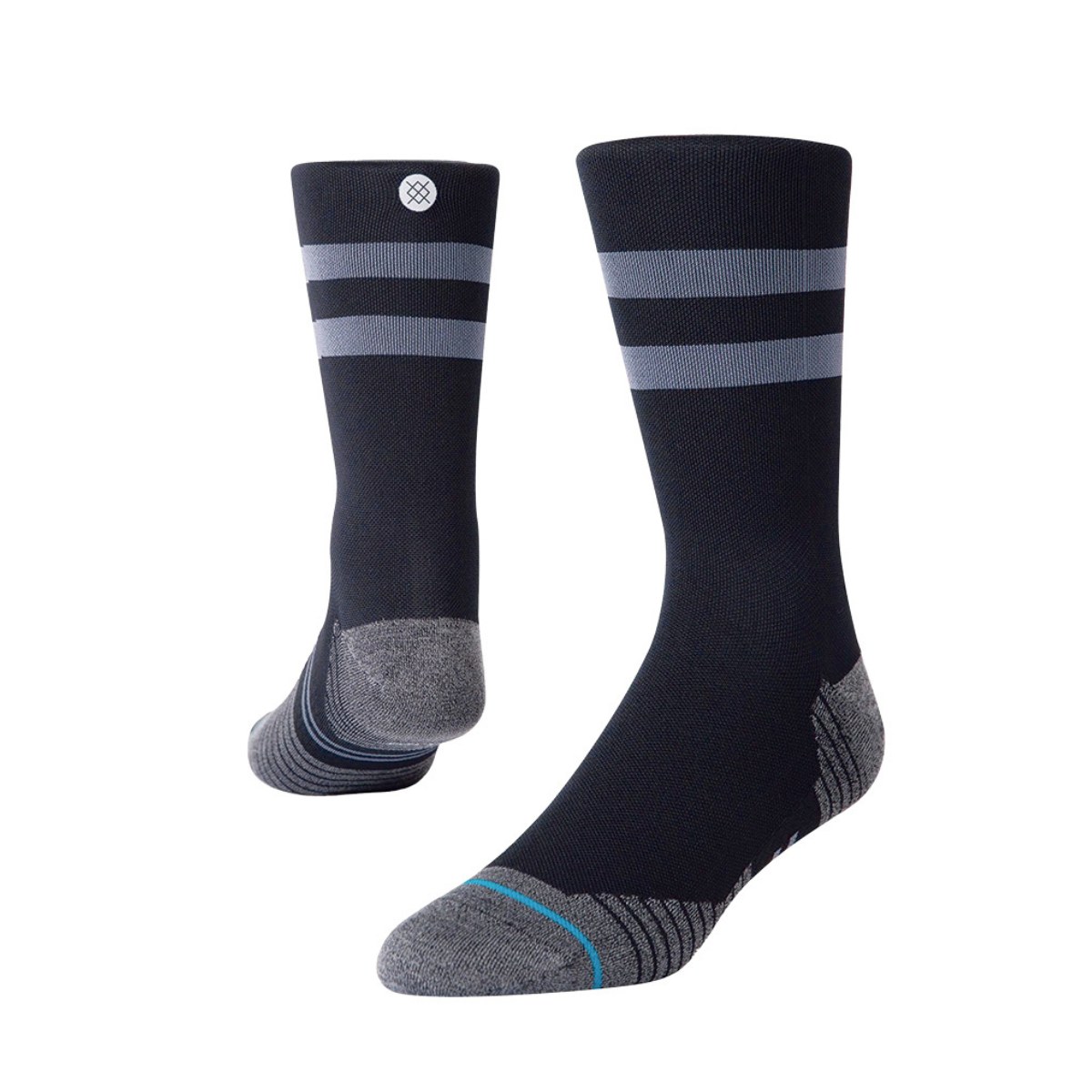 Dark navy socks with gray toes and two gray stripes at the top. One sock features a circular logo near the cuff. The overall look is sleek and sporty.